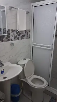a bathroom with a toilet and a sink and a shower at apartamento en marbella dúplex, cerca centro histórico - 3 in Cartagena de Indias