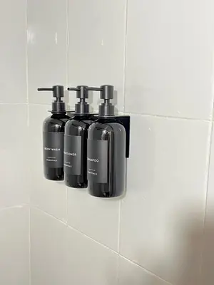 a group of three bottles on a tiled wall at Apartamento Cartagena - centro histórico in Cartagena de Indias