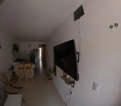 a flat screen tv hanging on a wall in a living room at Boquilla Cozy Spot Live Like a Local in Cartagena de Indias