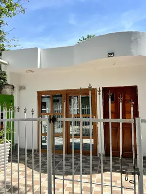 a house with a fence in front of it at Boquilla Cozy Spot Live Like a Local in Cartagena de Indias