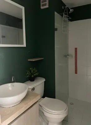 a bathroom with a toilet and a sink and a shower at Sea view apartment in Cartagena de Indias