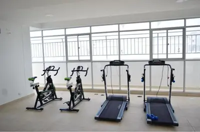 a gym with several tread machines in a room at Sea view apartment in Cartagena de Indias