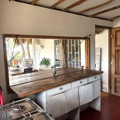 a bathroom with a large mirror above a sink at Coco y arena cabaña frente al mar, lejos del turismo y cerca a los manglares in San Bernardo del Viento