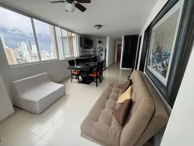 a living room with a couch and a table at Laguito Beach Cartagena in Cartagena de Indias