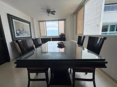 a dining room with a table and chairs at Laguito Beach Cartagena in Cartagena de Indias