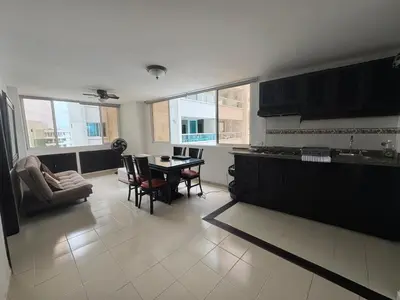 a kitchen with a table and chairs in a room at Laguito Beach Cartagena in Cartagena de Indias