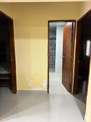 an open door to a room with a yellow wall at Villa Lexis in Coveñitas