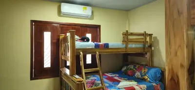 a bedroom with two bunk beds and a bed at Villa Lexis in Coveñitas