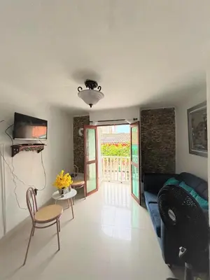 a living room with a couch and a table at Ritze's House Getsemani in Cartagena de Indias