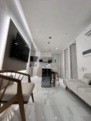 a white living room with a couch and a table at Santa marta bello horizonte Swift Lotf in Playa Bello Horizonte