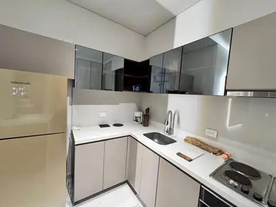 a kitchen with white cabinets and a sink at Santa marta bello horizonte Swift Lotf in Playa Bello Horizonte