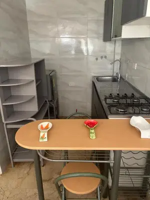 a small kitchen with a table and a stove at apartaestudio ideal manga in Cartagena de Indias