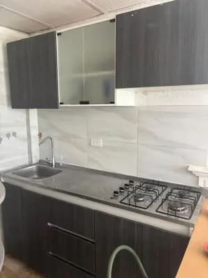 a kitchen with a stove and a sink at apartaestudio ideal manga in Cartagena de Indias