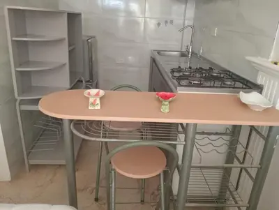a kitchen with a table with a sink and a stove at apartaestudio ideal manga in Cartagena de Indias