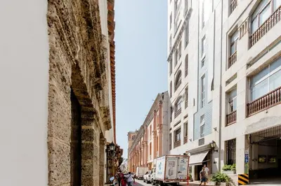an old building on a city street with buildings at Loft in Old Town, Cartagena in Cartagena de Indias
