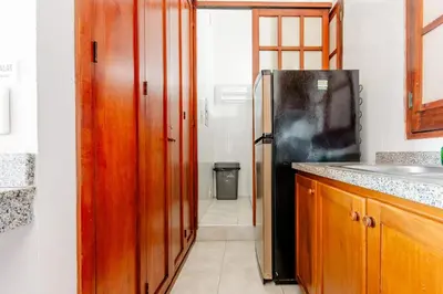 a kitchen with a refrigerator and a counter top at Loft in Old Town, Cartagena in Cartagena de Indias