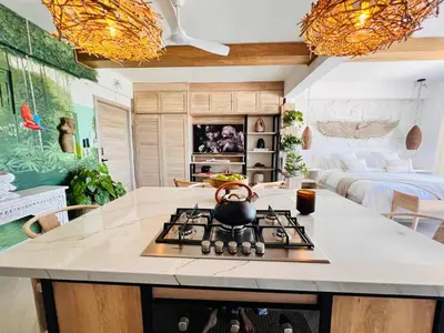 a kitchen with a stove with a tea kettle on it at Casa Manalva ocean view penthouse in walled city in Cartagena de Indias