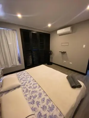a bedroom with a large bed and a window at Apto Torre Centauro, El Laguito in Cartagena de Indias