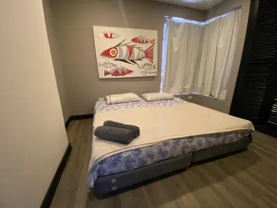 a bed in a room with two towels on it at Apto Torre Centauro, El Laguito in Cartagena de Indias