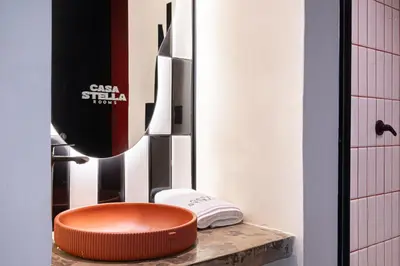 a bathroom with an orange bowl on a counter at Casa Stella Rooms in Cartagena de Indias