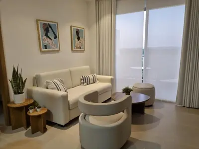 a living room with a couch and a table at Hermoso apartamento familiar in Cartagena de Indias