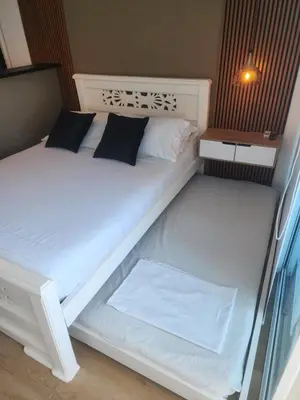 a white bed with two pillows on it at Lindo estudio con espectacular vista in Cartagena de Indias