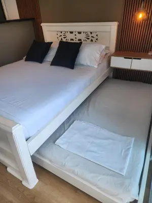 a white bed with two pillows on it at Lindo estudio con espectacular vista in Cartagena de Indias