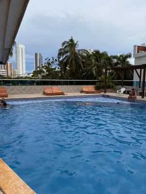 a large swimming pool with blue water at Lindo estudio con espectacular vista in Cartagena de Indias