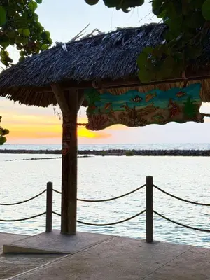 a straw hut with a rope around it next to the water at Amari Ocean House in Coveñas