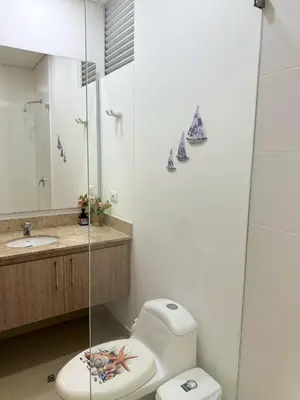 a bathroom with a toilet and a sink at Amari Ocean House in Coveñas