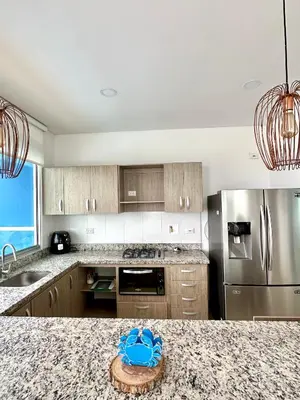 a kitchen with a granite counter top and stainless steel appliances at Amari Ocean House in Coveñas