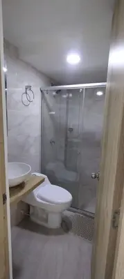 a bathroom with a shower and a toilet and a sink at Mirador de la Reserva Coveñas in Coveñas