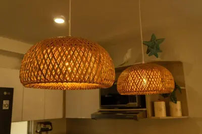 two lights hanging from the ceiling in a kitchen at Beach house in Cartagena de Indias