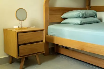 a bedroom with a bed and a dresser with a mirror at Beach house in Cartagena de Indias
