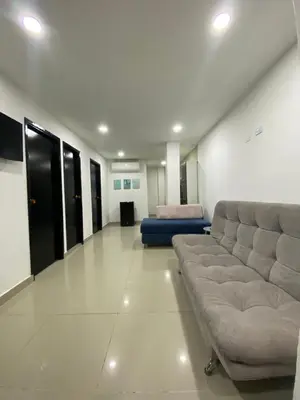 a living room with a couch and a bed at Apartamento 9 pax En Cartagena in Cartagena de Indias