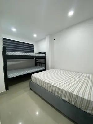 a bedroom with two bunk beds in it at Apartamento 9 pax En Cartagena in Cartagena de Indias