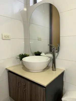 a bathroom with a sink and a mirror at Apartamento en la mejor zona de Barranquilla in Barranquilla