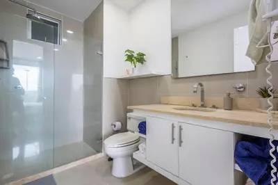 a bathroom with a toilet and a glass shower at 224 - Morros Epic Acceso Directo a Playa in Cartagena de Indias