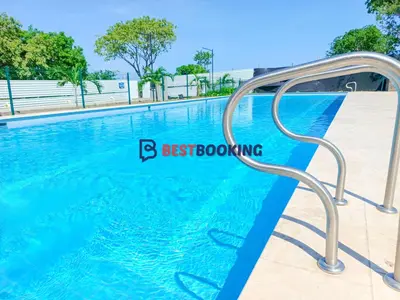 a swimming pool in a resort with blue water at Santa Marina Luxury Stay - Ocean View in Estación El Salto