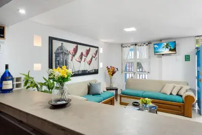 a living room with a couch and a table at Casa Mary Hotel in Cartagena de Indias