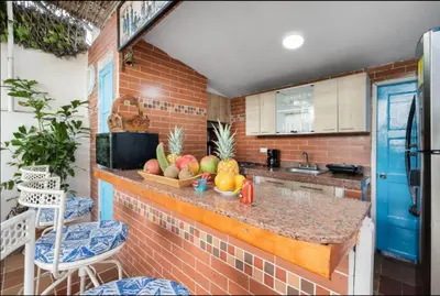 a kitchen with a counter with fruit on it at Casa Mary Hotel in Cartagena de Indias