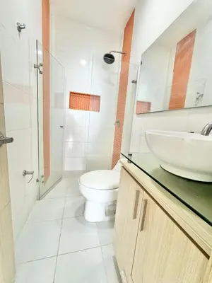 a bathroom with a toilet and a sink at Apto espectacular frente al mar in Coveñas