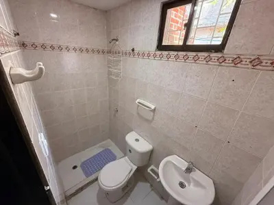 a bathroom with a toilet and a sink and a shower at Apartamento Montecristo in Barranquilla