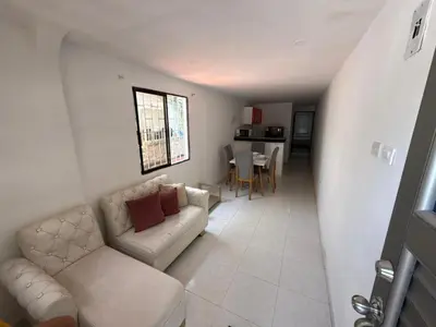 a living room with a couch and a table at Apartamento Montecristo in Barranquilla