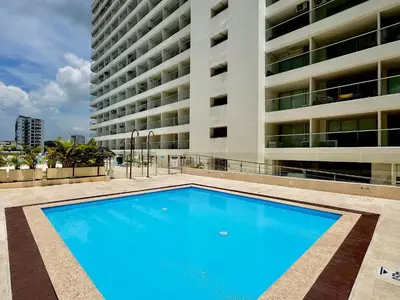 a large swimming pool in front of a building at Loft Vistas Mar. Crespo Piscina in Cartagena de Indias
