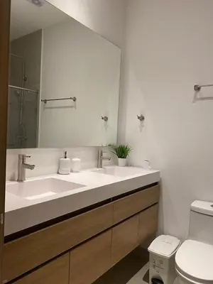 a bathroom with a sink and a mirror and a toilet at Cartagena Baia kristal Getaway in Cartagena de Indias
