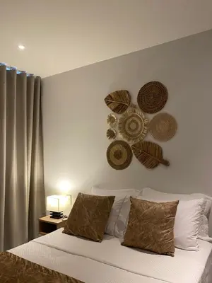 a bedroom with a bed with hats on the wall at Cartagena Baia kristal Getaway in Cartagena de Indias