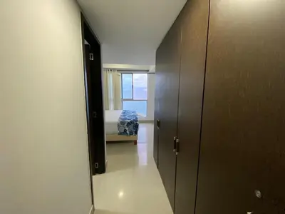 a hallway with a room with a bed and a window at Apartamento Palmetto Eliptic 23 ICDI in Cartagena de Indias