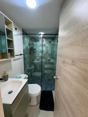 a bathroom with a shower and a toilet and a sink at Alma Kalamari 24 in Cartagena de Indias