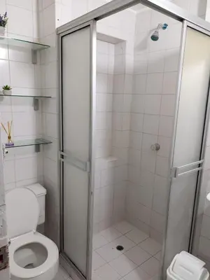 a bathroom with a shower and a toilet at Habitación cerca al aeropuerto # 4 in Cartagena de Indias